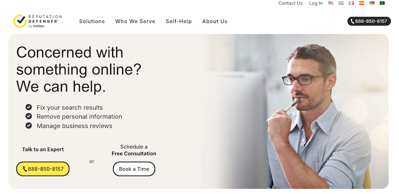 A man with glasses thoughtfully holds a pen, gazing at his computer screen. Text beside him reads, "Concerned with something online? We can help." Reputation Defender offers solutions, including chatting with an expert or scheduling a free consultation.