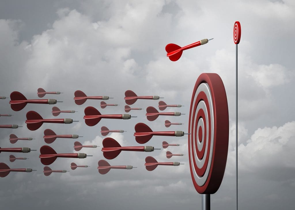 A group of red darts hitting a target in the sky.